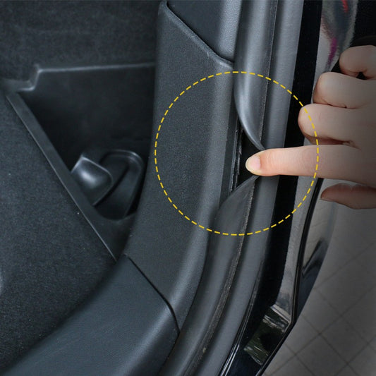 Boot corner storage box for Tesla Model Y – close-up of finger pressing door trim seal