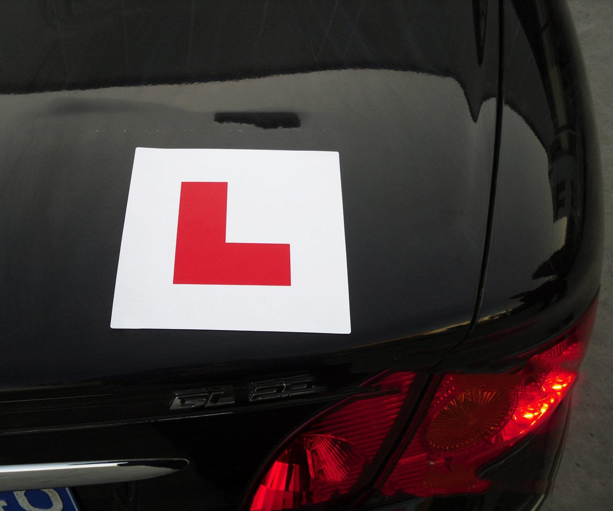 Magnetic L plates for learner drivers, 178mm – fitted on a black car boot