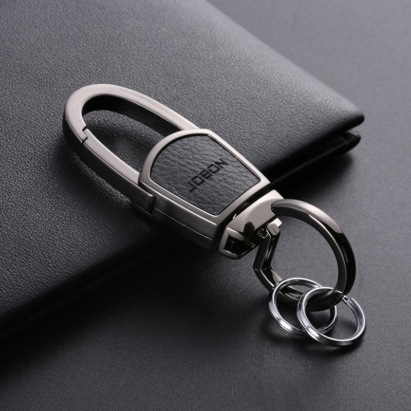 Metal chain car keyring – gunmetal keyring with double split rings on a notebook