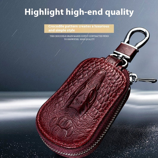 Genuine leather car key case – universal fit – crocodile-pattern burgundy case on wet surface with highlight text