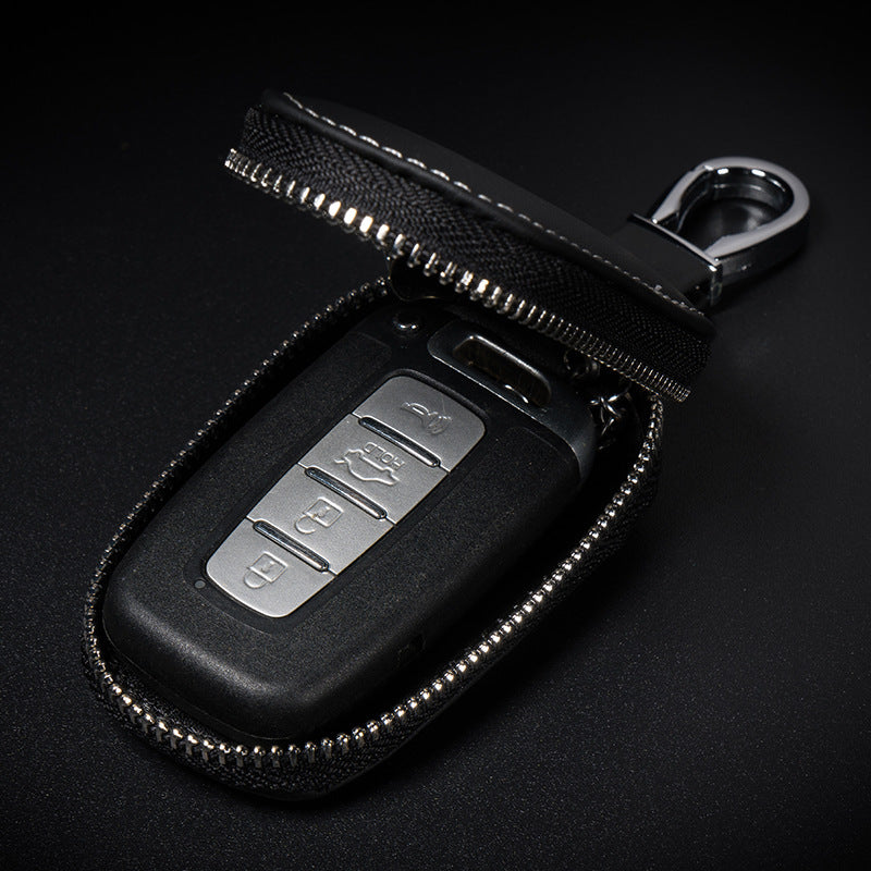 Cowhide leather zip cover for smart car keys – open zip pouch revealing a car key fob inside