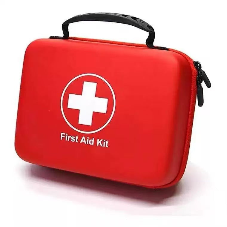 Car first aid kit in hard-shell case – closed red hard-shell case with carry handle