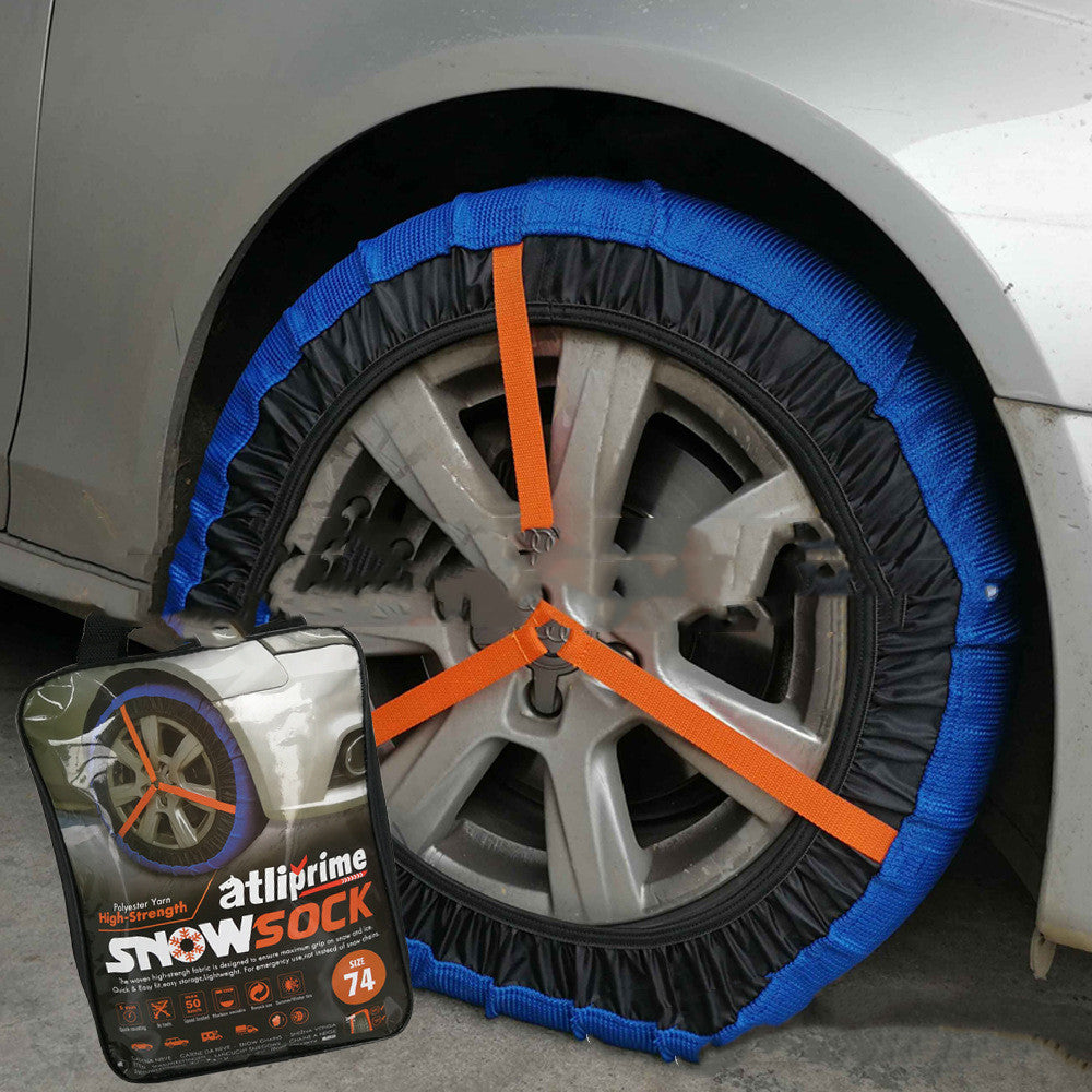 Textile snow sock for car tyres – fitted on a car wheel showing orange straps