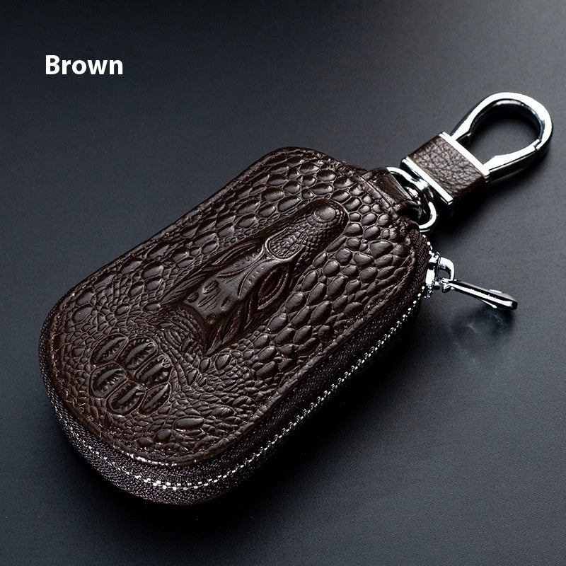 Genuine leather car key case – universal fit – brown crocodile-pattern case standing upright labelled brown