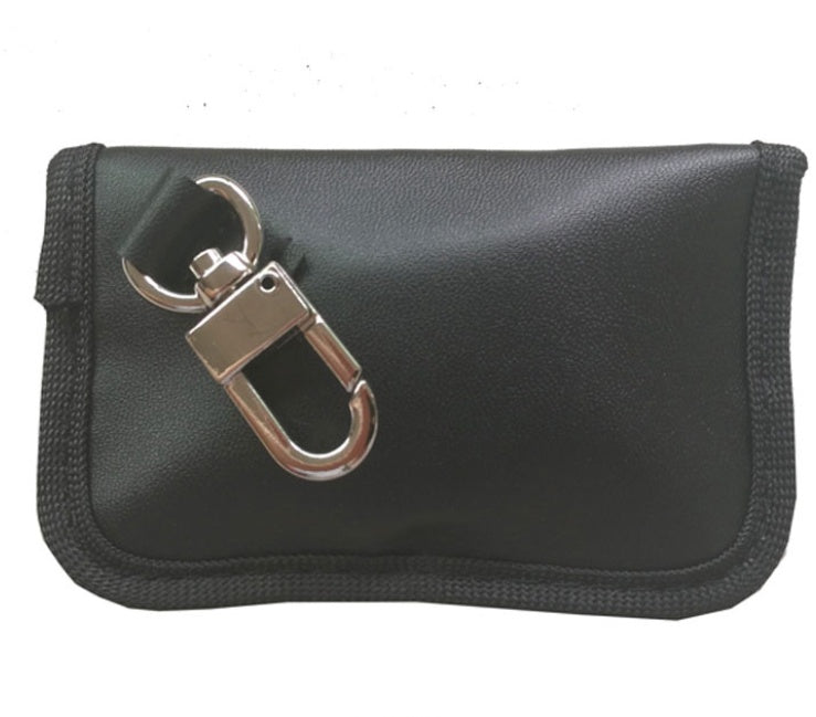 Black PU car key case with anti-scan protection – rear view showing metal clip closed