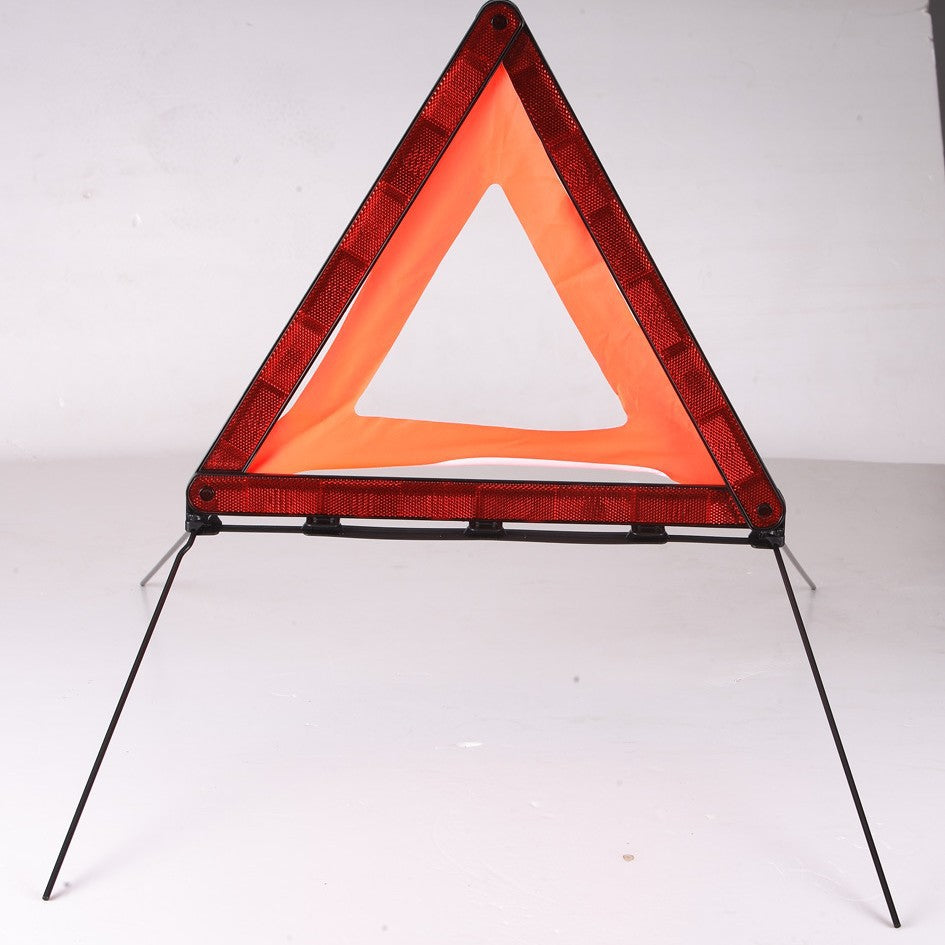 Reflective car warning triangle for emergency stops – standing upright with legs extended, front view