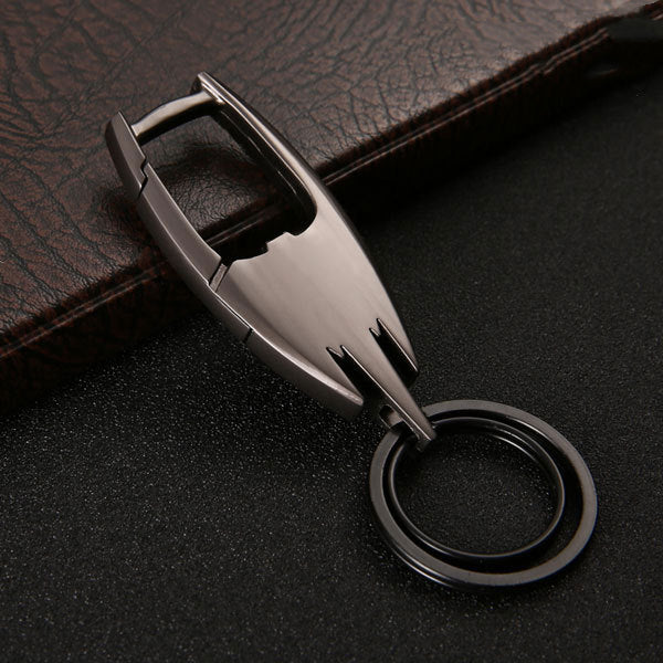 Stainless steel car key ring – close-up of black keyring on leather