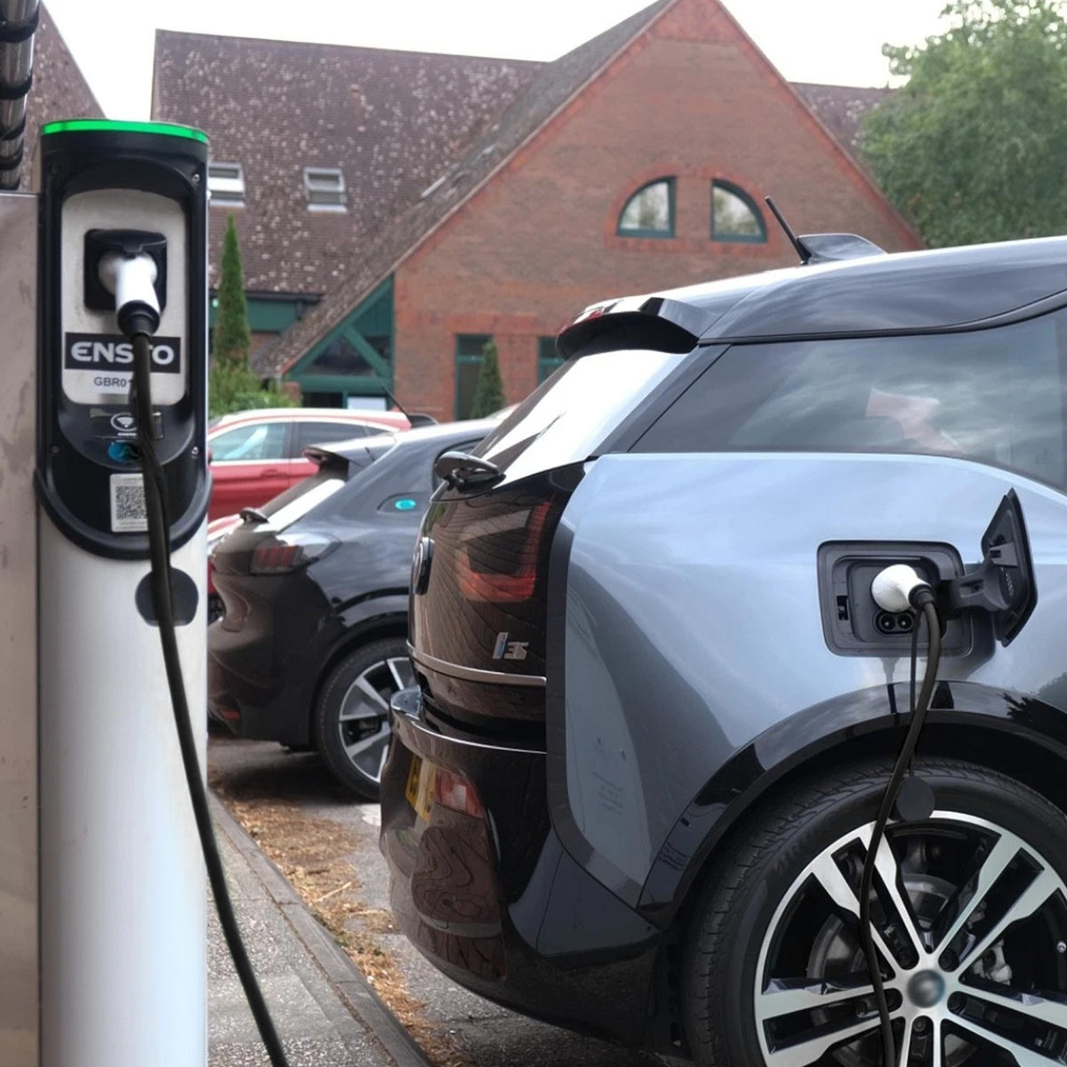 32A Type 2 to Type 2 EV charging cable, 5m – plugged into a car at an outdoor charging point