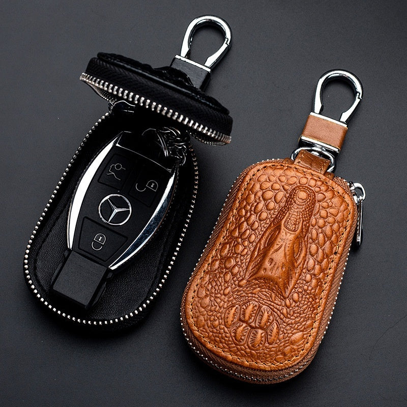 Genuine leather car key case – universal fit – tan case open beside a Mercedes smart key fob
