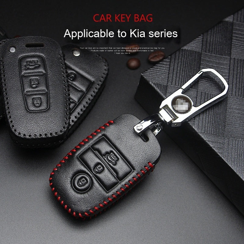 Key fob case for Kia smart & folding keys – genuine leather – black leather case with keyring on gift box background